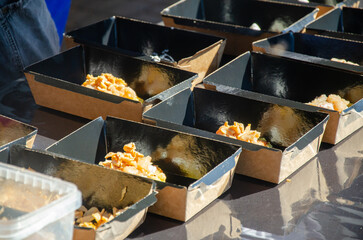 Food in food containers on a street stall