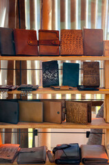 Leather goods purses and partmones on the store counter
