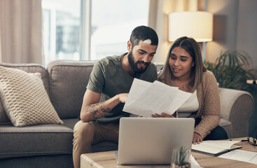 Couch, couple and discussion with paperwork for finance, track expenses or planning for budget...