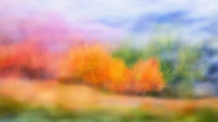 Dreamy autumn landscape with vibrant foliage in soft focus, creating an impressionistic scene of golden trees and colorful meadows under a pastel sky.