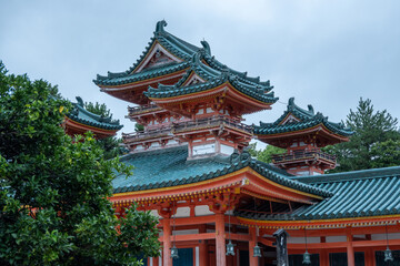 Shinto shrine showing traditional japanese architecture with cloudy sky
