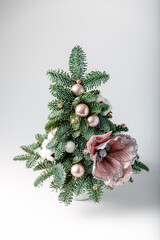Christmas and New year composition. Home decoration with pine tree branches, flowers, toys. Copy space.