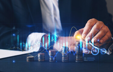 Businessman stacking coins with a graph of profit. Business successful  growth