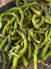 Close-Up of Fried and Salted Green Chillies: Indian Snack Delight