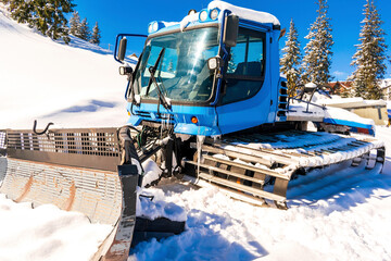 Modern snowcat ratrack with snowplow,snow grooming machine,remover truck preparing ski...