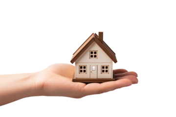 A single hand gently supporting a tiny house replica, isolated on a clean white background