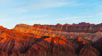 Beautiful Danxia landform during sunset at Kuche Grand Canyon National Geopark along Duku Highway...