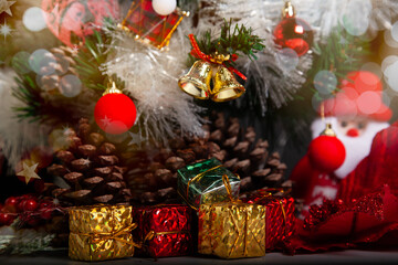 Decoration details of a Christmas tree decorated in red and gold.