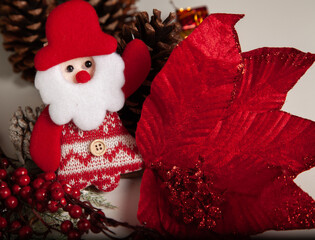 Decoration details of a Christmas tree decorated in red and gold.