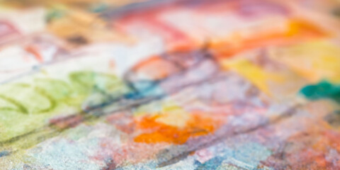 Naklejka premium Vibrant abstract watercolor painting with bold hues and dynamic patterns