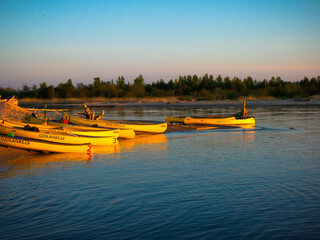 Fototapeta premium Fishing boats at the mouth of the Gauja River at sunset, Latvia