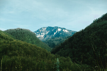 Beautiful view of the spring hills and mountains with the remaining snow