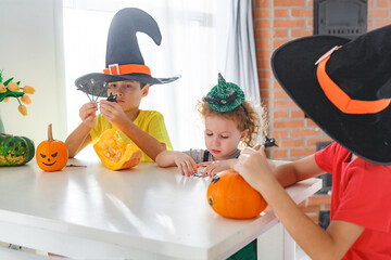 Three real siblings two brothers and one sister having fun together while preparing to Halloween at...