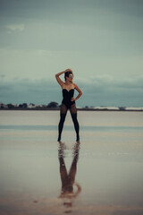 Young woman at the salt lake at the evening 