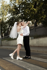 Newlyweds guy and girl. Wedding. White dress. Happiness.