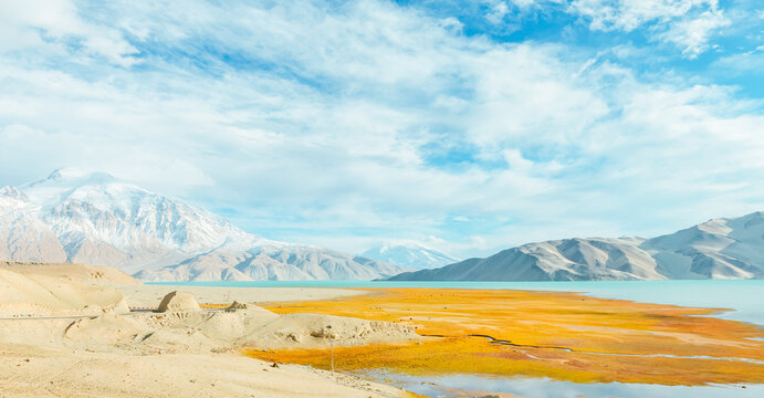 The autumn scenery of the Baisha Lake and Baisha Mountain and wetland landscape along National Highway G314 on the Pamir Plateau in Xinjiang, China during October