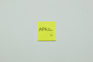 April sign on a sticky note.