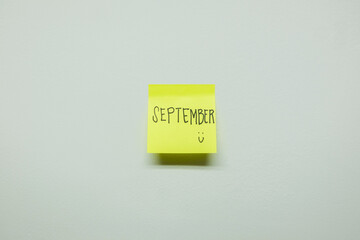 September sign on a sticky note.