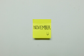 November sign on a sticky note.