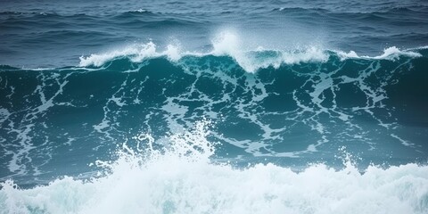 Naklejka premium Powerful ocean wave crashing against rocky shore, spraying sea foam and creating dramatic display of force and beauty, wave, powerful, ocean