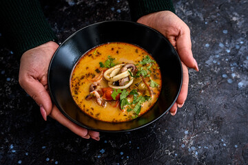 Spicy Seafood Soup with Squid and Fresh Herbs