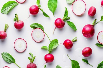 Fresh radish slices surrounded by vibrant green leaves in an artistic photography capture