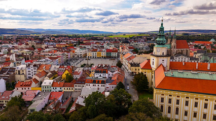 Fototapeta premium Kromeriz city castle and gardens top cinematic aerial view. Czech Republic, Europe. Historic European town in Czech Republic. Romantic european town, church view