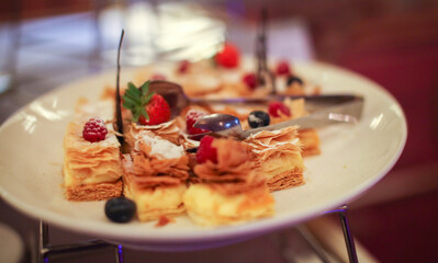 Delicious colorful decorated baked sweet tasty party cakes or catering cakes for party, bar dessert selection with cake, pie and pastries catering banquet, coffee break buffet at a conference content