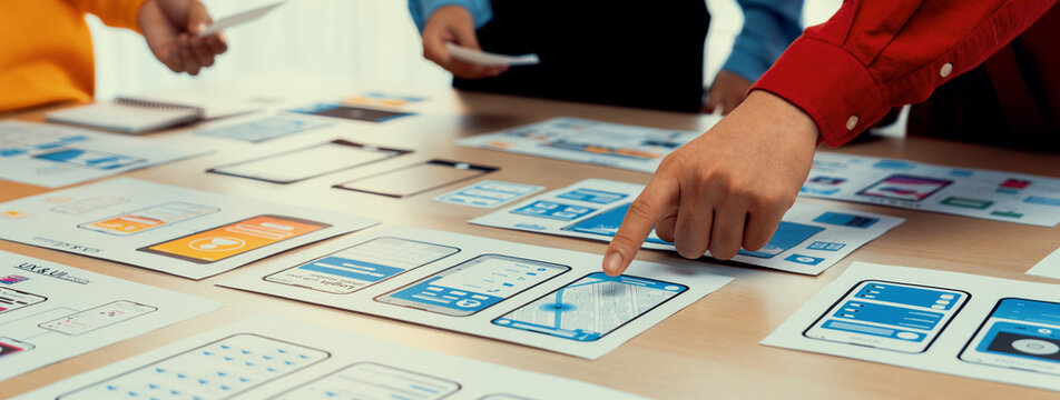 Panorama banner of startup company employee planning on user interface prototype for mobile application or website in office. UX UI designer brainstorm user friendly interface plan. Synergic