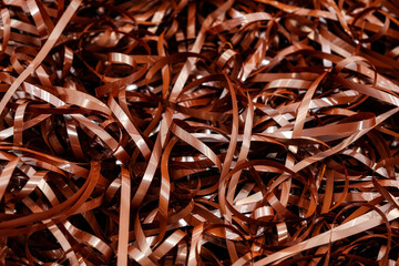 Magnetic tape unwound, magnetic audio cassette tangle, evoking nostalgia and the fragility of...