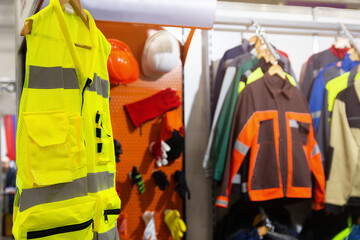 Special protective, work clothes, various jackets for builders in the store