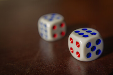 close uo of two white dices put on a wooden table