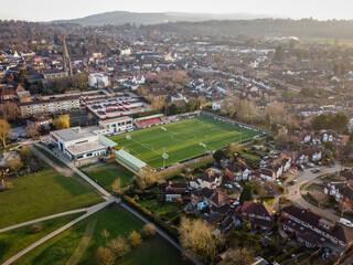 Dorking, Surrey, UK- Aerial view of Dorking Wanderers FC stadium and town centre