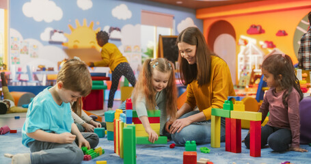 Happy Kindergarten Pedagogue Having a Conversation with Kids, Using Enthusiastic Teaching Methods...