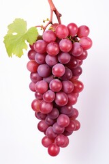 Fototapeta premium Ripe beautiful blue or pink grapes on a white background.