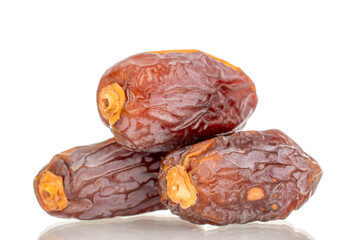Dried sweet dates  isolated on white background, close-up.