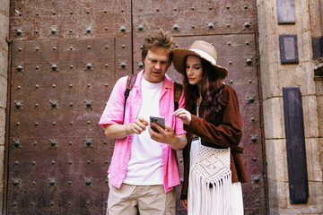 A Couple Enjoying Their Time Exploring Together on a Smartphone Adventure in an Urban Setting