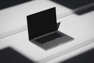 Scene with an open laptop with a blank screen on a concrete background