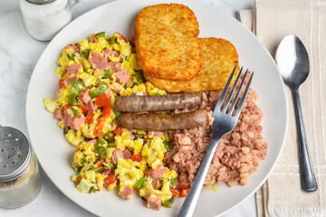 scramble eggs  with  corn beef hash and  sausages