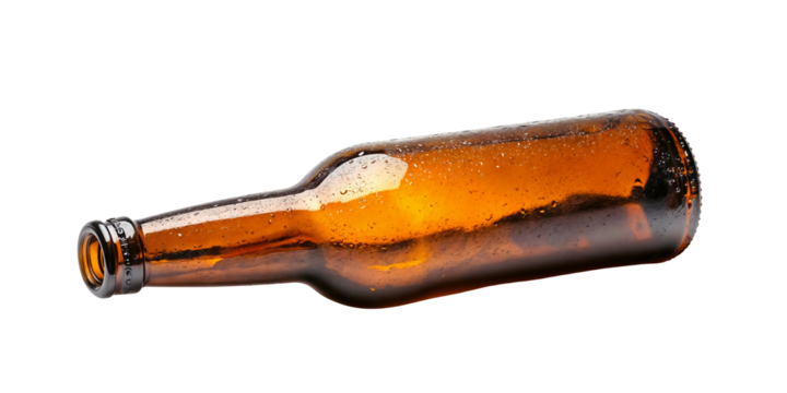 A brown glass beer bottle lying down, isolated over transparent background, PNG cut-out