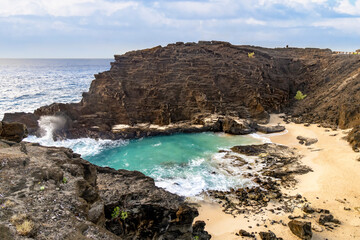 Halona Beach, nestled in a rocky cove with breaking Pacific waves on the Hawaiian Island of Oahu, was made famous in the movie, “From Here to Eternity.”