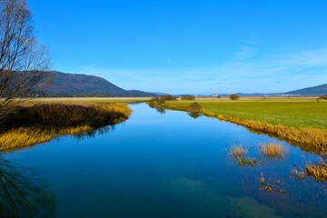 View of Stržen river at intermittent lake Cerkniško jezero in Notranjska, Slovenia