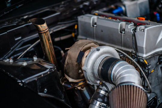Heat shield from a very hot turbo.The heat shield prevents the engine from accumulating high heat.The big turbo is in the gasoline engine.Large turbos are put on drift cars.