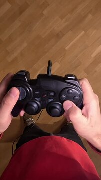 vertical video First-person view pov Gamer playing videogames holding controller