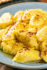 Homemade lazy noodles with cheese, crumbs and melted butter.