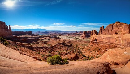 Fototapeta premium Vibrant Horizons: Exploring the Sunlit Canyons of Arches