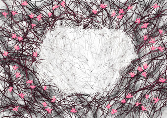 Background with a place for text or lettering. For a postcard, invitation or advertisement. Drawing in gothic dark style. Black bush branches and pink flowers in early spring