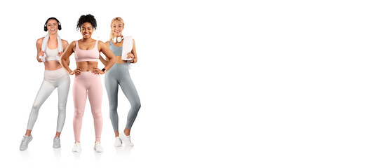 Three women are engaging in fitness activities, wearing colorful activewear and showing enthusiasm...