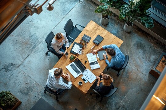 Business professionals meeting in a corporate office. Collaborative discussion and brainstorming for a new business strategy