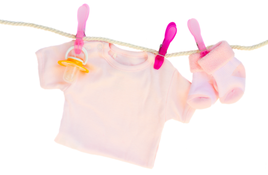 baby girl clothes hanging on rope
